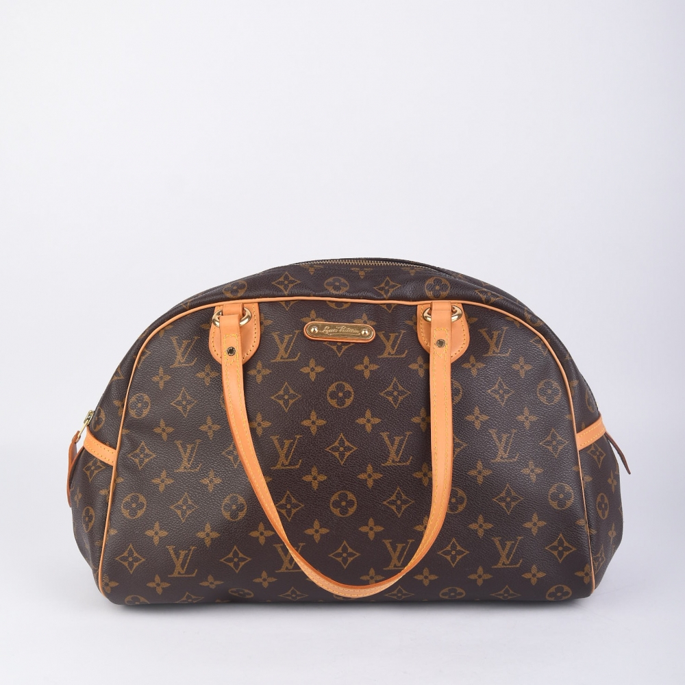 Louis Vuitton Montorgueil i brun monogram canvas med gulltonet hardware og helt nytt skinn. Produsert i Frankrike (kode MI4009) – en stor og funksjonell tote-veske med klassisk Louis Vuitton-stil og moderne brukervennlighet.
